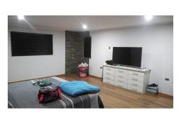 PARCELA CON VANGUARDISTA CASA EN EL TOTORAL